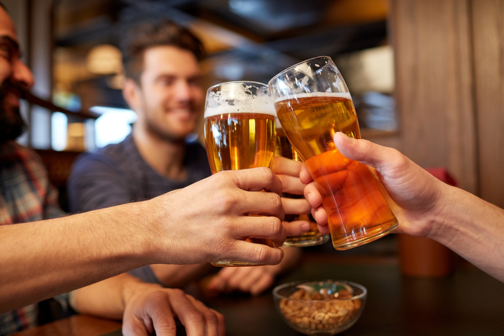 Happy Male Friends Drinking Beer 
